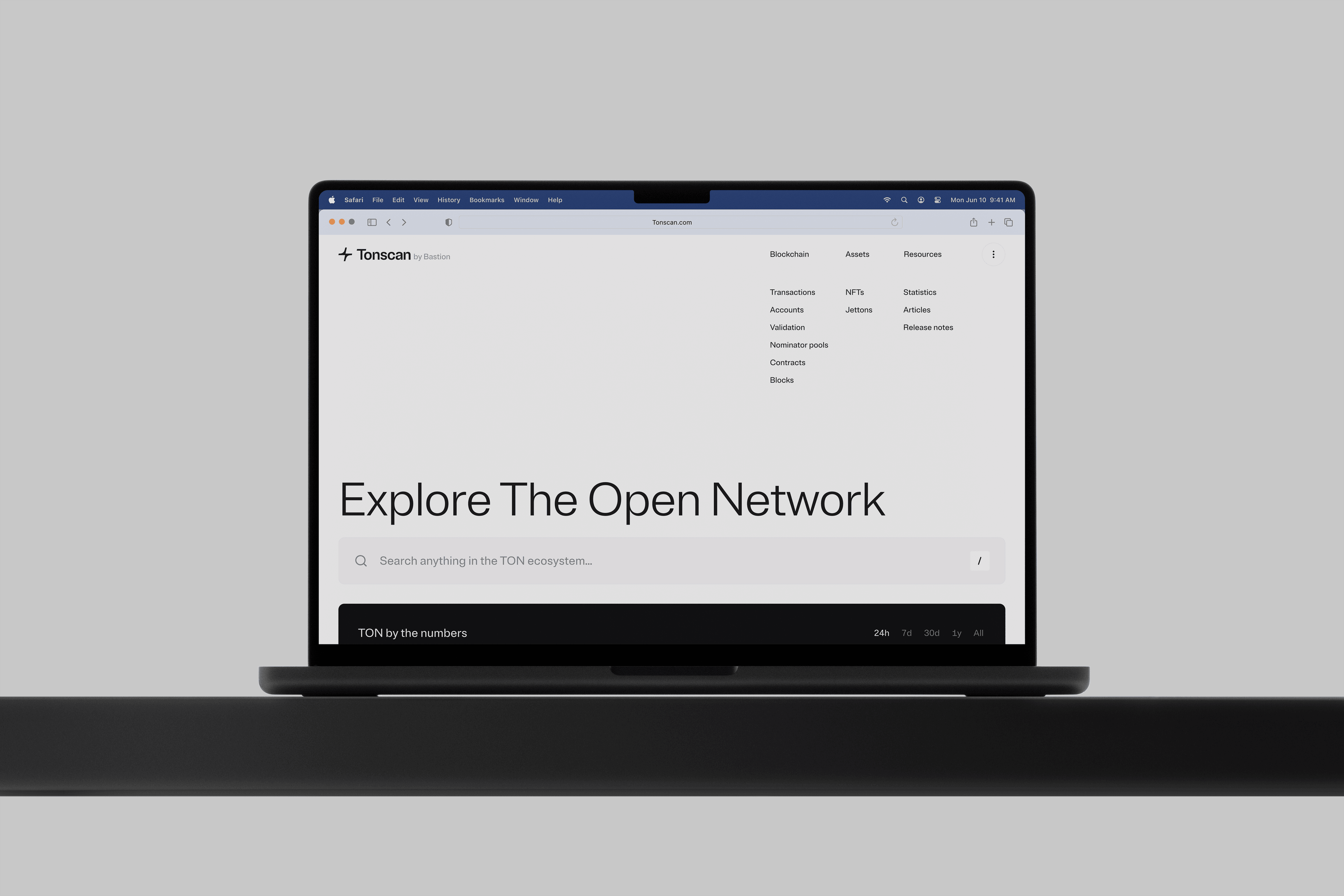 Frontal view of an open laptop, with the Tonscan homepage open, saying "Explore the Open Network"